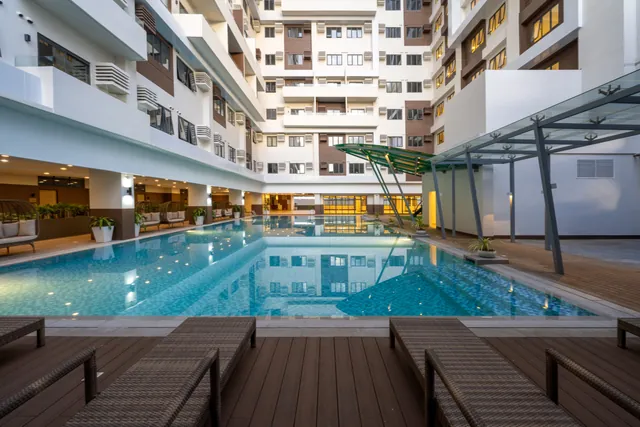 The lap pool in the building courtyard, with loungers