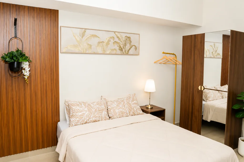The bed with the wardrobe alongside